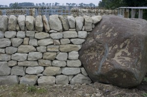 Dry stone wall and boulder