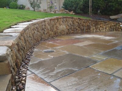 Livingston back garden patio and dry stone retaining wall