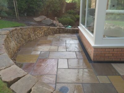 Livingston back garden patio and dry stone retaining wall