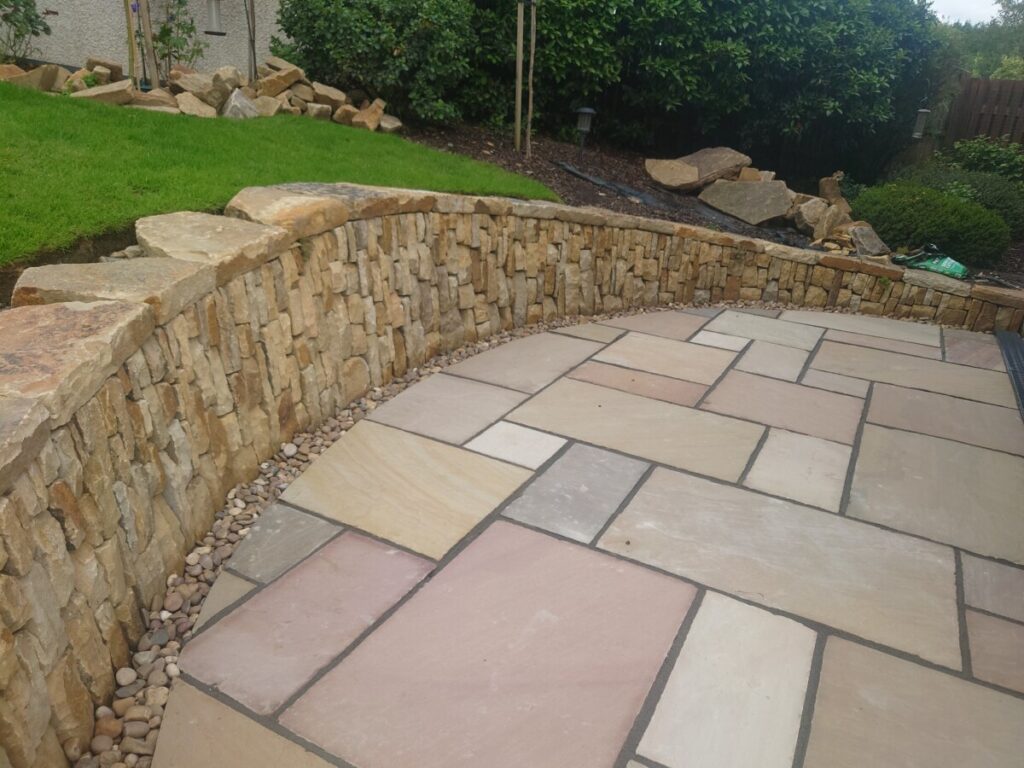 Livingston back garden patio and dry stone retaining wall